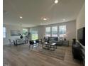 Bright living room with modern furniture and large windows offering natural light at 2728 Princess Tree Dr, Raleigh, NC 27616