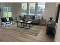 Bright living room with modern furniture and large windows offering natural light at 2728 Princess Tree Dr, Raleigh, NC 27616