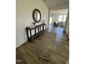 Inviting entryway showcasing a wooden console table, round mirror, and stylish runner rug at 466 Saint Clair Dr, Fuquay Varina, NC 27526