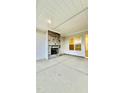 The spacious covered patio includes a stone fireplace at 2048 Abbeyhill Dr # 98, Raleigh, NC 27610