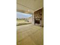 View of the covered patio with fireplace and outdoor space at 2048 Abbeyhill Dr # 98, Raleigh, NC 27610