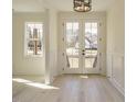 Bright and spacious entryway with double doors and hardwood floors at 30 Tamaran Ct, Spring Hope, NC 27882
