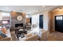 Spacious living room with a modern fireplace and ample natural light at 1005 Bridgeforth Ln, Chapel Hill, NC 27517