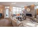 Bright living room featuring a fireplace and access to a back patio at 1005 Bridgeforth Ln, Chapel Hill, NC 27517