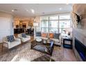 Open living space with a fireplace and views into the kitchen and dining area at 1005 Bridgeforth Ln, Chapel Hill, NC 27517