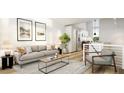 Open concept living room features a large couch, modern decor, and an open view to the kitchen at 106 Broadway St # 202, Durham, NC 27701