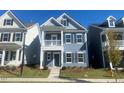 Two-story home with gray siding and a balcony at 9228 Kitchin Farms Way # 412, Wake Forest, NC 27587