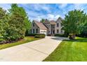Two-story house with a large yard and driveway at 11603 Broadfield Ct, Raleigh, NC 27617