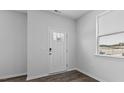 Bright entryway featuring a white door with sidelights and views to the front yard at 543 Old Battle Bridge Rd, Wendell, NC 27591