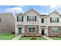 Attractive two-story home with stone accents and a well-maintained front lawn at 543 Old Battle Bridge Rd, Wendell, NC 27591