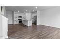 Spacious kitchen featuring stainless steel appliances, granite counters, and hardwood floors at 543 Old Battle Bridge Rd, Wendell, NC 27591