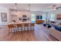 Modern kitchen with a large island, white cabinets, and stainless steel appliances at 457 Duncan Creek Rd # 141, Lillington, NC 27546