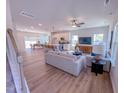 Spacious open-concept living area with modern furnishings and hardwood floors at 457 Duncan Creek Rd # 141, Lillington, NC 27546