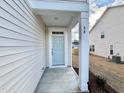 Light teal front door with a covered porch at 48 Flowing River Rd # 35, Angier, NC 27501