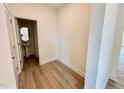Small powder room with pedestal sink and mirror at 48 Flowing River Rd # 35, Angier, NC 27501