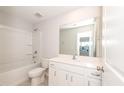 Clean bathroom with a white vanity, modern fixtures, and a tub-shower combo at 569 Marthas Vw Way, Wake Forest, NC 27587