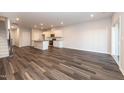 Spacious living room showcasing beautiful flooring and an open-concept layout at 569 Marthas Vw Way, Wake Forest, NC 27587