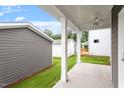 A serene back porch with ceiling fan offers a relaxing outdoor living space at 9301 Kitchin Farms Way # 433, Wake Forest, NC 27587