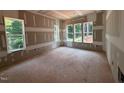 Bright bedroom with multiple windows offering views of the surrounding greenery, awaiting personalization at 111 Gaines Trail, Pittsboro, NC 27312