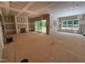 Spacious living room with sliding glass doors, fireplace, and drywall ready for customization at 111 Gaines Trail, Pittsboro, NC 27312