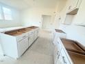 Kitchen island with white cabinets and drawers at 38 Longdale Dr, Graham, NC 27253