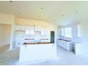 Spacious kitchen with white cabinets and large island at 38 Longdale Dr, Graham, NC 27253