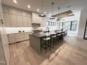 Spacious kitchen featuring stainless steel appliances, modern cabinetry, and a large center island at 5208 Knollwood Rd, Raleigh, NC 27609