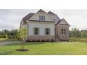 Charming new construction home boasting a well-manicured lawn and elegant exterior details at 55 Harvest View Way, Franklinton, NC 27525