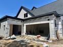 Spacious three-car garage with open layout under construction, offering ample parking and storage at 37 Green Turtle Ln, Pittsboro, NC 27312