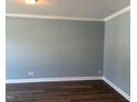 Serene bedroom featuring neutral paint, hardwood floors and electric outlets on the wall at 9140 Dupree Meadow Dr # 9, Angier, NC 27501