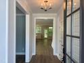 Bright foyer with hardwood floors, modern lighting, and an open view of the home's interior at 9140 Dupree Meadow Dr # 9, Angier, NC 27501