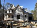 New construction home with wrap-around porch and large windows at 1317 Old Lystra Rd, Chapel Hill, NC 27517