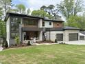 Beautiful two-story home with a two-car garage, manicured lawn, and attractive modern design at 4123 Rockingham Dr, Raleigh, NC 27609