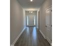 Inviting entryway showcasing modern gray wood-look flooring and neutral paint at 60 Lemon Drop Ln, Franklinton, NC 27525