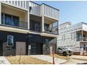 Townhome building showcasing rear elevation with attached garages at 1531 Urban Trace Ln, Raleigh, NC 27608