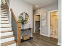 Modern staircase with wood treads and black metal railing at 1531 Urban Trace Ln, Raleigh, NC 27608