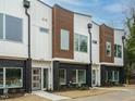 Stylish townhome exterior with modern architectural details, including mixed materials and large windows at 1533 Urban Trace Ln, Raleigh, NC 27608