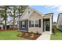 Charming single-story home featuring a mix of brick and siding, and a well-manicured lawn at 791 Washington St, Fuquay Varina, NC 27526