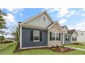 Charming single-story home featuring a mix of brick and siding, and a well-manicured lawn at 791 Washington St, Fuquay Varina, NC 27526