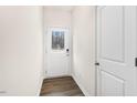 Bright entryway with a white door with glass and a wood-look floor at 802 Dorset Stream Dr, Fuquay Varina, NC 27526