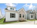 Charming home features a brick facade, white siding, and well-maintained landscaping at 802 Dorset Stream Dr, Fuquay Varina, NC 27526