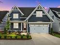 Stunning two-story home with a modern exterior and a well-maintained front yard at 416 S Cross St, Youngsville, NC 27596