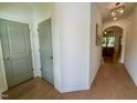 Bright hallway with gleaming hardwood floors and neutral paint creating an inviting transition to the living spaces at 196 Grand Griffon Way, Lillington, NC 27546