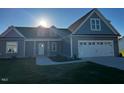 Attractive one-story home featuring a two-car garage and a well-maintained lawn at 941 Olive Branch Dr, Smithfield, NC 27577