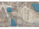 Aerial view showcasing the property's location in relation to the surrounding area and nearby lakes at 1917 New Hill Olive Chapel Rd, New Hill, NC 27562
