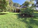 Charming brick home with a welcoming front porch and lush green lawn at 1917 New Hill Olive Chapel Rd, New Hill, NC 27562