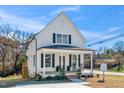 Charming two-story home with a welcoming front porch and manicured landscaping at 195 N Smith St, Clayton, NC 27520