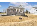 Two-story home with stone exterior and landscaped yard at 73 Jumper St, Wendell, NC 27591