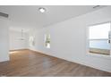 Bright dining room with hardwood floors and chandelier at 3911 Willow Gate Way, Raleigh, NC 27604