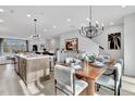 Open concept kitchen and dining area with hardwood floors at 3010 Freewinds Way # 43, Cary, NC 27519